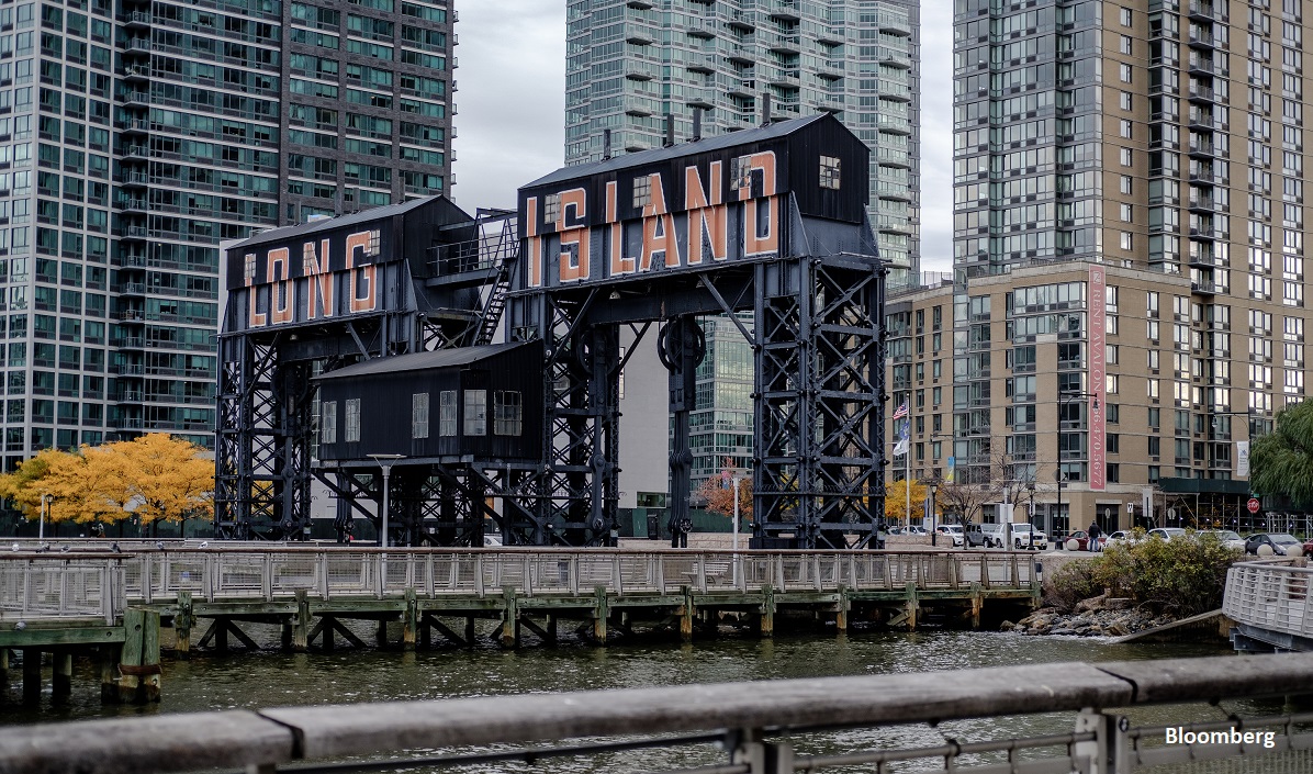A gantry that reads "Long Island" is seen from Gantry Plaza State Park in the Long Island City neighborhood in the Queens borough of New York, U.S., on Friday, Nov. 9, 2018. As reports emerged this week that Amazon.com Inc. was close to an agreement to set up a new office hub in Long Island City, the prospect of all those jobs, shoppers, and potential tenants or homebuyers drew cheers in the fast-growing neighborhood across the East River from Manhattan. Photographer: Christopher Lee/Bloomberg