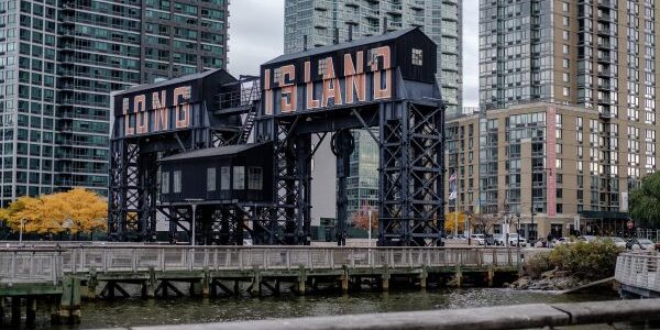 A gantry that reads "Long Island" is seen from Gantry Plaza State Park in the Long Island City neighborhood in the Queens borough of New York, U.S., on Friday, Nov. 9, 2018. As reports emerged this week that Amazon.com Inc. was close to an agreement to set up a new office hub in Long Island City, the prospect of all those jobs, shoppers, and potential tenants or homebuyers drew cheers in the fast-growing neighborhood across the East River from Manhattan. Photographer: Christopher Lee/Bloomberg